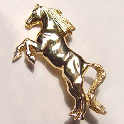 14 kt. yellow gold rearing horse brooch with diamond eye