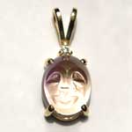 gold oval carved Amatrine and diamond pendant