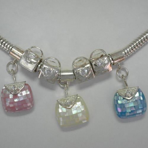 Close up of Frolic Purse Charms of Frolic Charm Bracelet