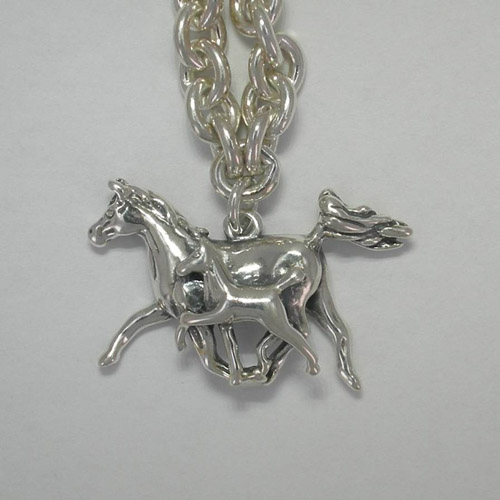 Close up of Arabian mare and foal charm of bracelet