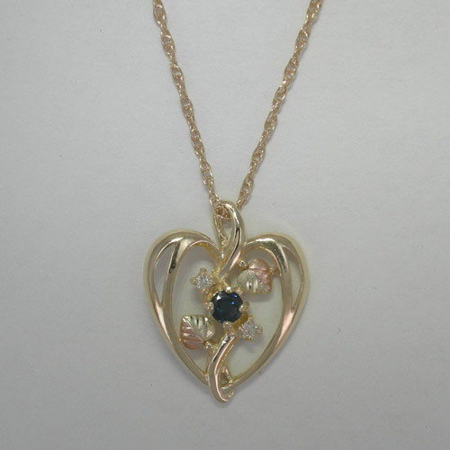 10 karat yellow gold Black Hills Gold heart shaped diamond and Sapphire nec