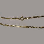 14 Kt.y.g. close up of Figaro chain