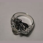 Side view of wolf and moonstone ring