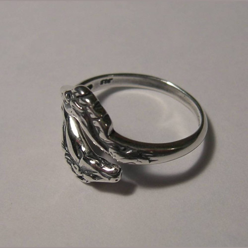side of Sterling Silver double horsehead ring
