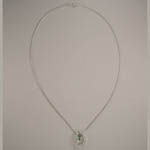 Sterling Silver Cubic Zirconia and emerald cross inside horseshoe necklace