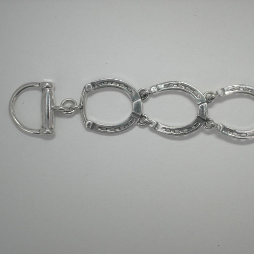 close up of clasp of horseshoe bracelet