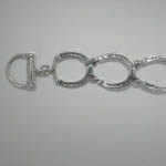 close up of clasp of horseshoe bracelet