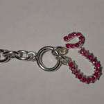 close up of clasp of ruby horseshoe bracelet