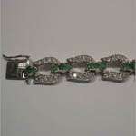 Tongue clasp of emerald and Cubic Zirconia horseshoe bracelet