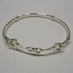 different angle of childs snaffle bit bangle bracelet