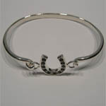 side view of sapphire horseshoe bangle bracelet