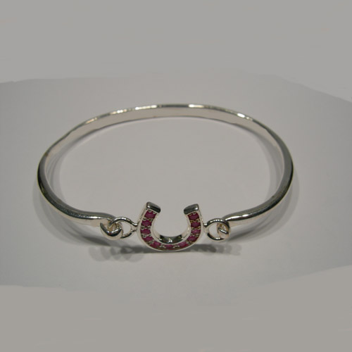 side view of ruby horseshoe bangle bracelet