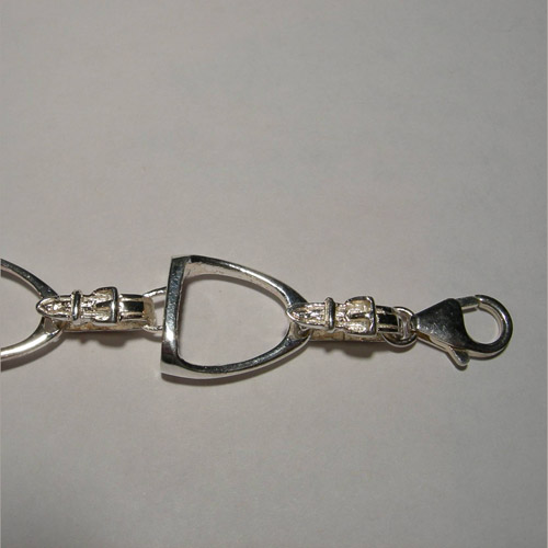 close up of stirrup bracelet clasp