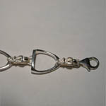 close up of stirrup bracelet clasp