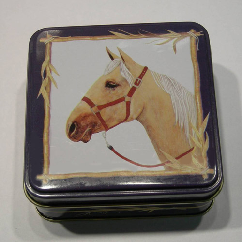 Small blue tin with horse head on cover