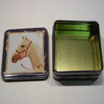 Small blue tin with lid open